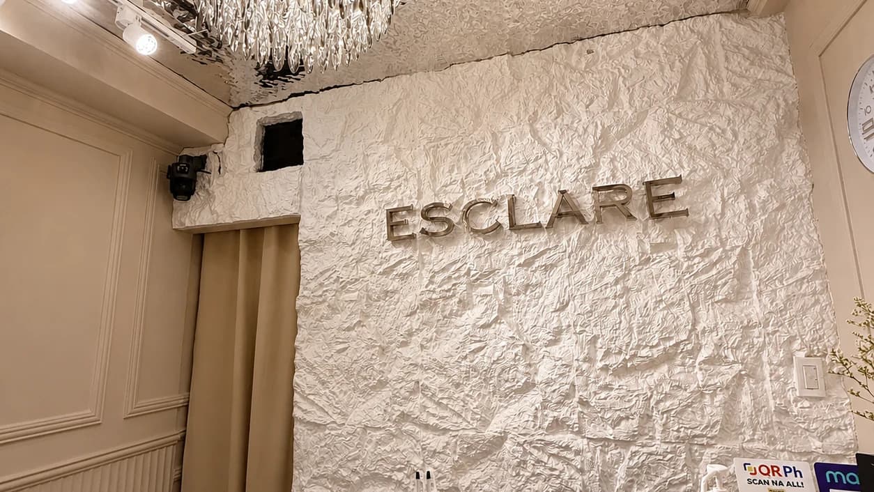 The authentic ESCLARE Naga reception and textured logo wall